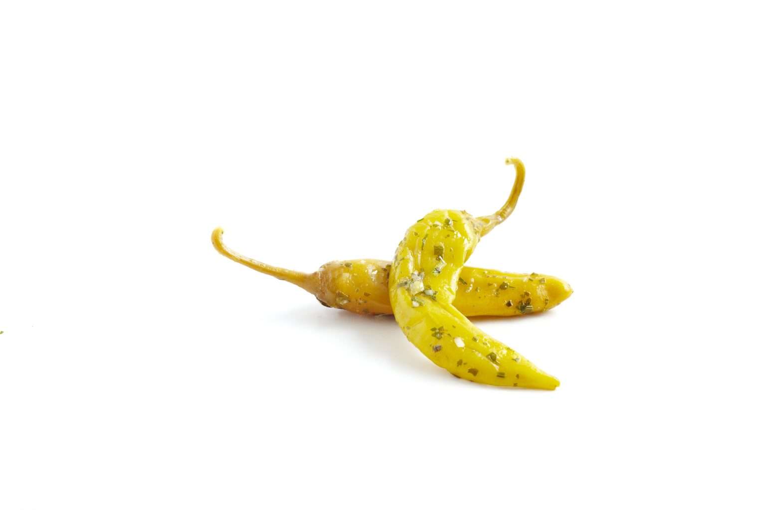 Grüne Peperoni in Kräuteröl